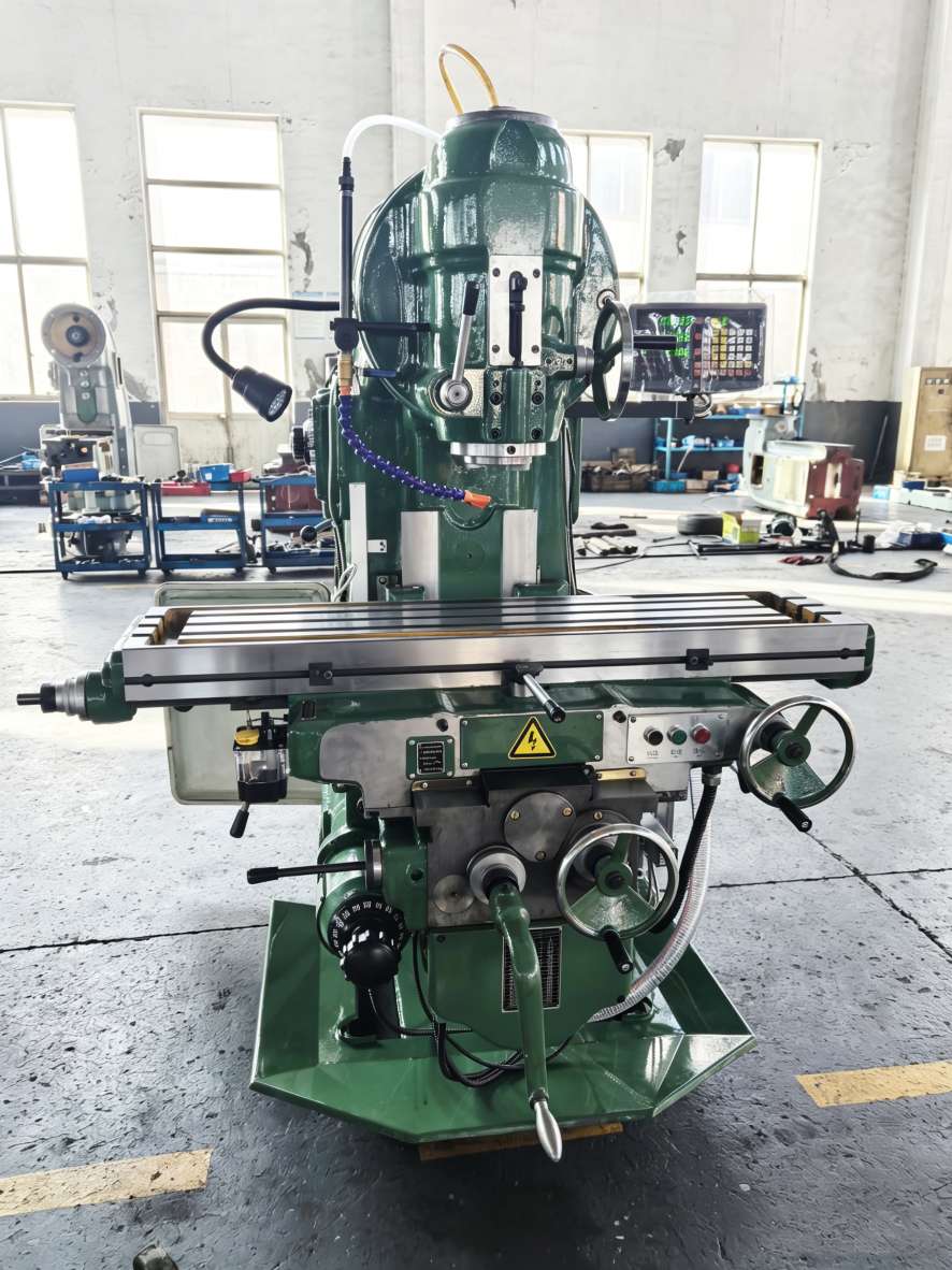 Heavy duty X5040 knee type vertical mill in workshop showing robust cast iron structure
