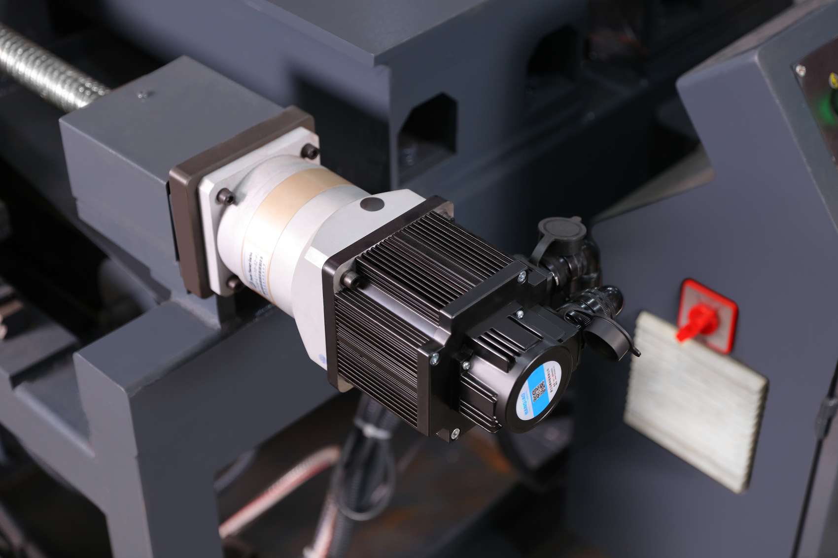 High precision vertical band saw cutting zone showing carbide blade guides and T slot worktable by MFG