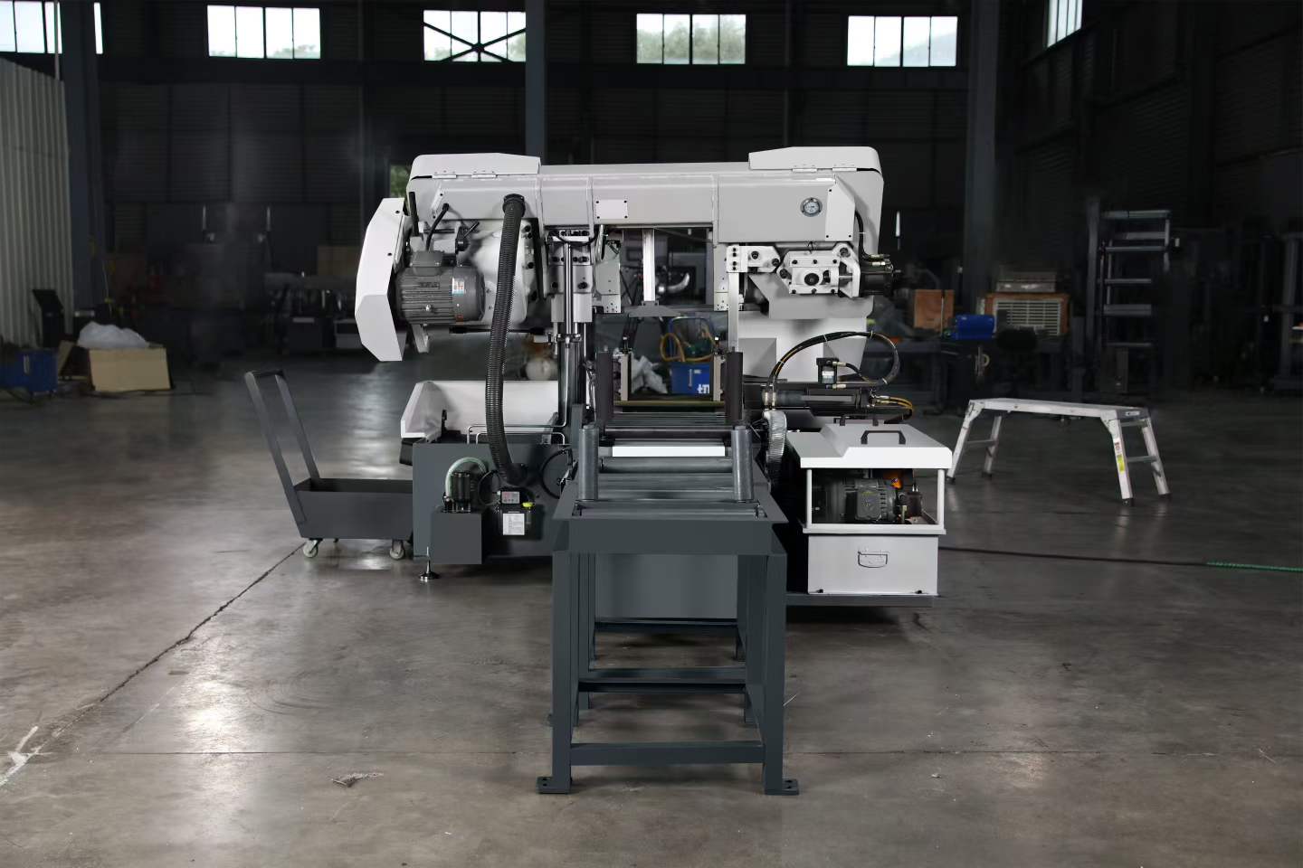 Rear view of the M1-330C band saw machine displaying the main motor drive and automatic chip conveyor system