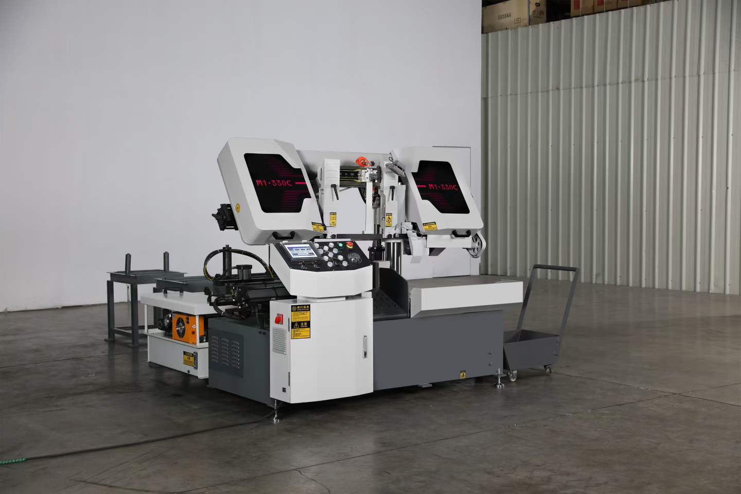 Front view of the actual M1-330C automatic metal cutting machine highlighting the touchscreen control panel and hydraulic clamping area