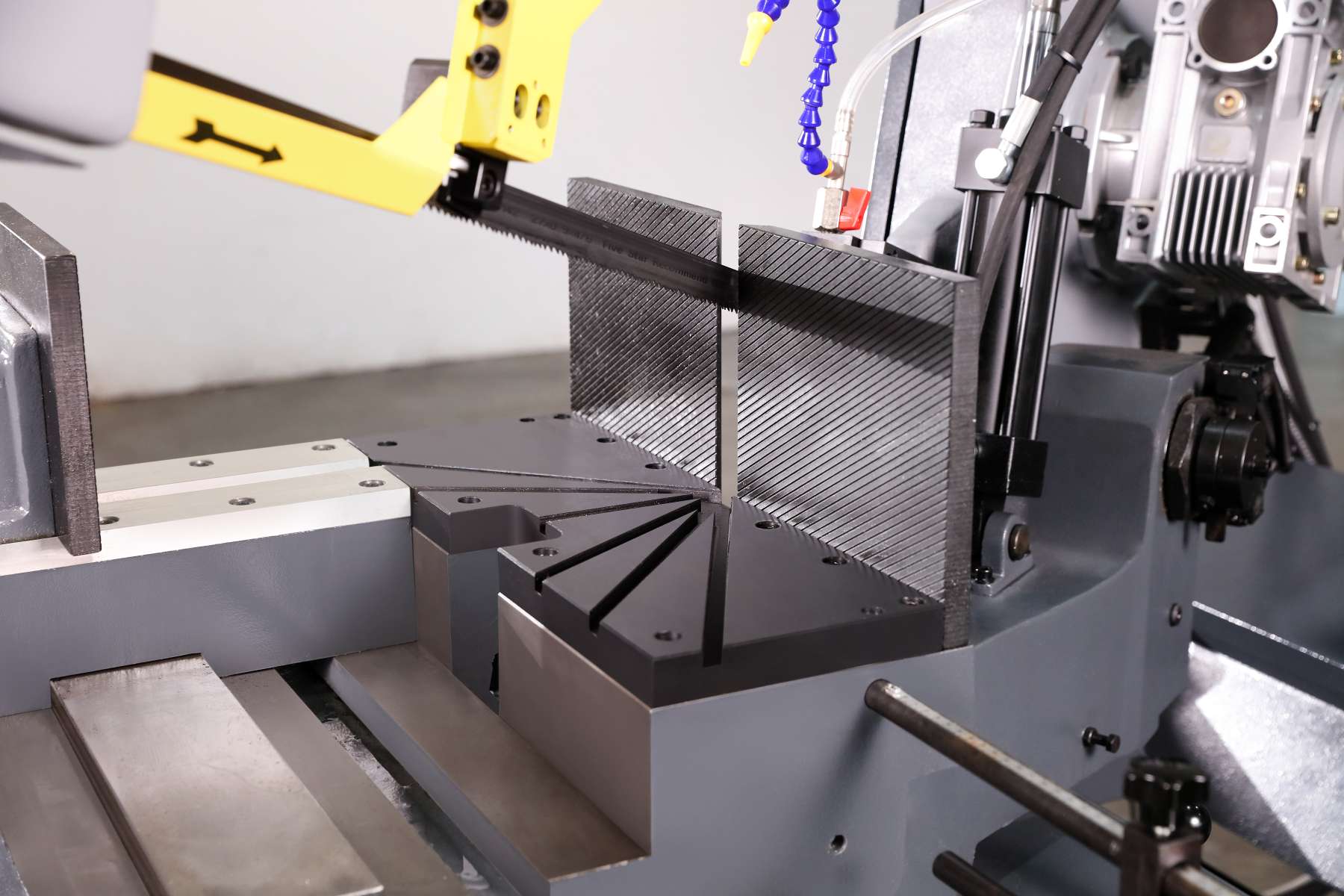 VSR treated welded steel scissor type bow frame on semi automatic bandsaw by MFG